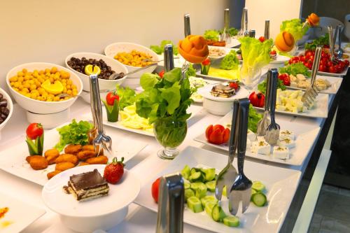 a buffet with many plates of food on a table at Grand Zara Hotel in Kayseri