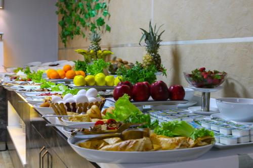 a buffet with many plates of food on a table at Grand Zara Hotel in Kayseri