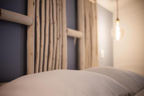 a close up of a bed in a room at Le Logis de la Gabirotte in Nieulle-sur-Seudre