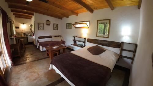 Postel nebo postele na pokoji v ubytování Granja La Lechuza Ecolodge