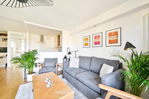 a living room with a couch and a table at GuestReady - Central London stay near King's Cross in London