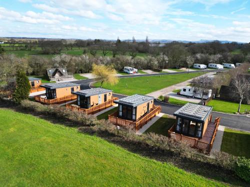 an aerial view of a group of mobile homes at Royal Umpire Caravan Park in Croston