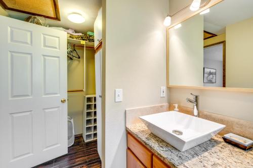 a bathroom with a sink and a mirror at Pet-Friendly Ocean Park Rental with Outdoor Fire Pit in Ocean Park