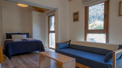 Ένα ή περισσότερα κρεβάτια σε δωμάτιο στο Alamos del Rio - Andarlibre