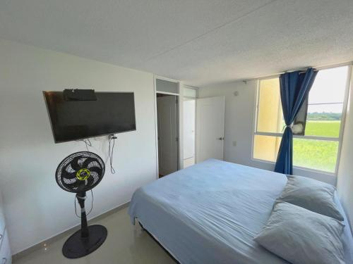 Ένα ή περισσότερα κρεβάτια σε δωμάτιο στο New palmira APARTMENT