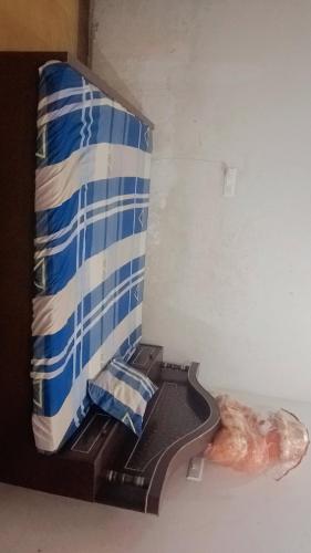 a shelf in a room with blue and white at Reyansh homestay in Ayodhya