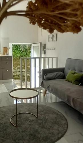 a living room with a couch and a table at La Mar de Ben in Muros