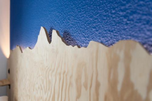 a close up of a cake with blue icing at Côté Lac Hostel Evian in Évian-les-Bains