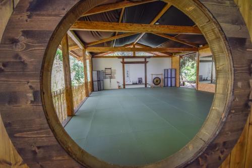 an inside view of a room with a large wooden wall at Penedo Escape Nature in Colares