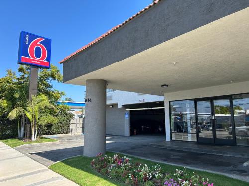 a building with a no parking sign in front of it at Studio 6 Suites Gardena, CA in Gardena