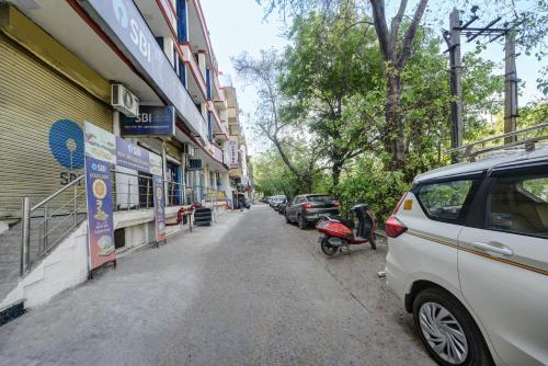 a street with cars parked on the side of a building at Hotel City Centre Inn Near Nizamuddin Railway Station in New Delhi