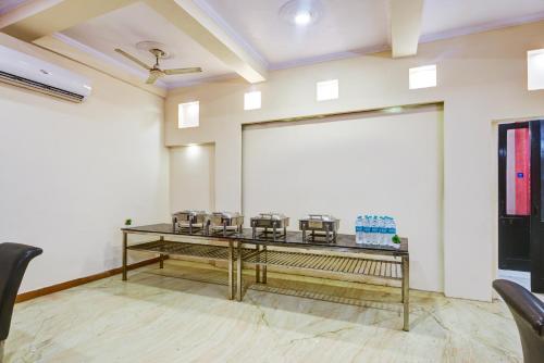 a conference room with a projector screen and chairs at Hotel City Centre Inn Near Nizamuddin Railway Station in New Delhi