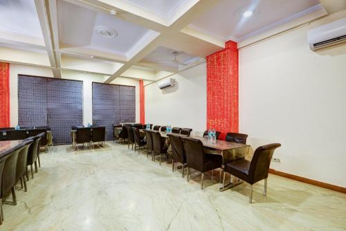 a dining room with tables and chairs and red bricks at Hotel City Centre Inn Near Nizamuddin Railway Station in New Delhi