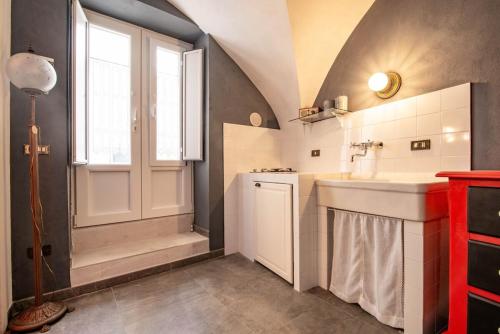 a bathroom with a sink and a shower at Studio Raguso in Martina Franca