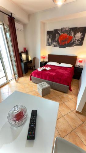 a bedroom with a bed with a red blanket at B&B Vanvitelli Home in Caserta