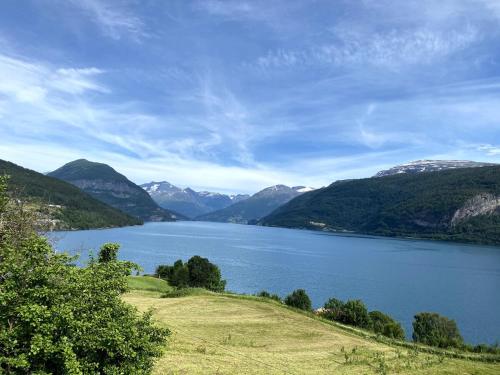 a view of a lake with mountains in the background at Stryn - Faleide - Cabin Fjord view in Stryn