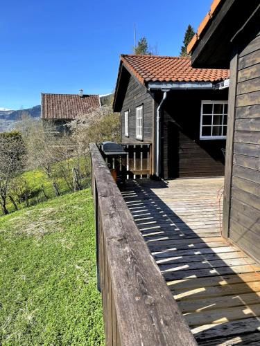 a wooden fence in front of a house at Stryn - Faleide - Cabin Fjord view in Stryn