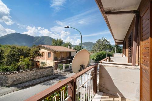 a balcony with a view of the mountains at Casa Vacanza il Noce in Santa Lucia di Serino