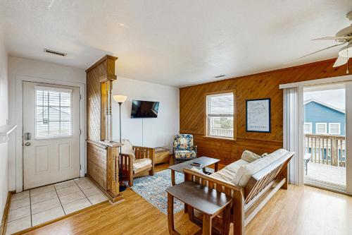 a living room with a couch and a table at Tarpon Drive Hideaway Unit B in Avon