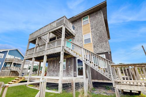 a house with a staircase in front of it at Tarpon Drive Hideaway Unit B in Avon