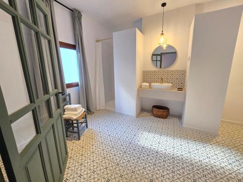 a bathroom with a sink and a mirror at La Rinconada de Perales in Perales de Tajuña