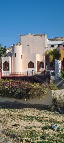 a white building with a fence in front of it at DAR SALIA entre Agadir et Taghazout in Aourir