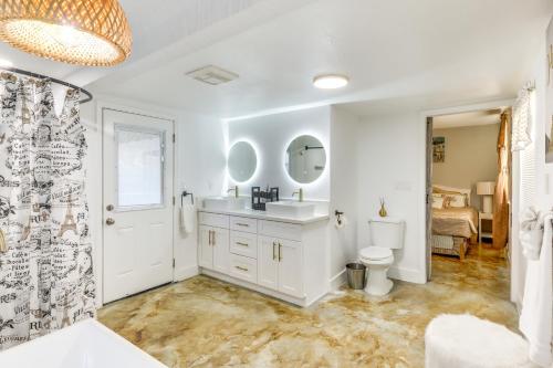 a bathroom with a sink and a toilet and a mirror at Hikers Paradise Twentynine Palms Home with Deck! in Twentynine Palms