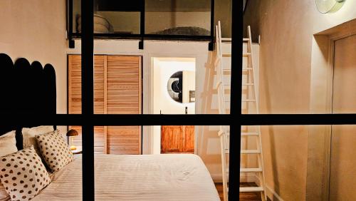 Cama o camas de una habitación en L'hôtel des oiseaux