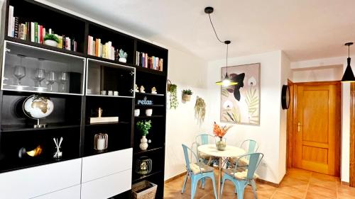 a dining room with a table and chairs at LOS SAUCES DE DAIMUS - Alquiler solo a Familias in Daimuz