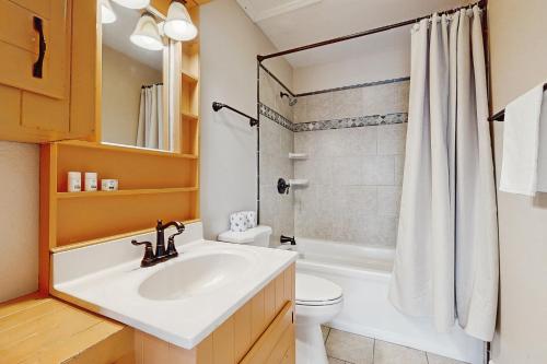 a bathroom with a sink and a toilet and a shower at Tarpon Drive Hideaway Unit A in Avon