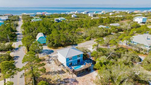 an aerial view of a blue house and the ocean at Private Beach-Private Pool-Easy walk to the Beach in Gulf Highlands