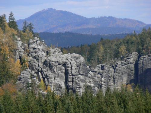 a large rock formation in the middle of a forest at Apartmány Hájenka in Vápenka