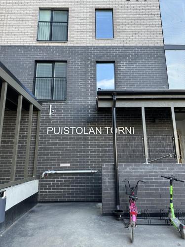 a bike parked in front of a brick building at Cosy studio in the center of Jyvaskyla in Jyväskylä