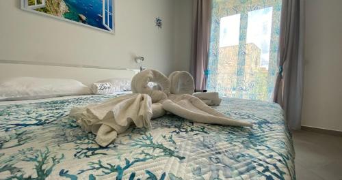 a swan made out of towels on a bed at Bn'b Diva in Naples