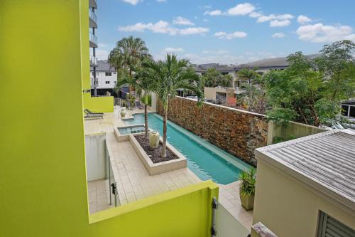 a view of a swimming pool from a building at Luxury Cairns Stay with Pool and BBQ in Cairns