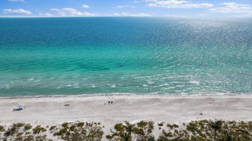 an aerial view of a beach with the ocean at Sunset Sanctuary in Longboat Key