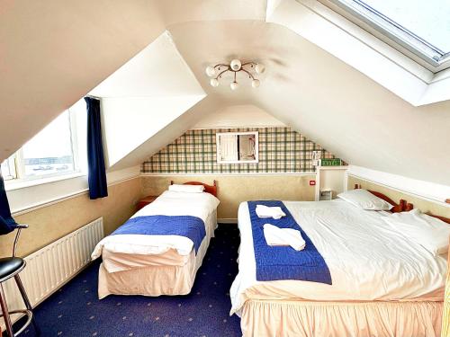 Ένα ή περισσότερα κρεβάτια σε δωμάτιο στο Harbour Heights B&B