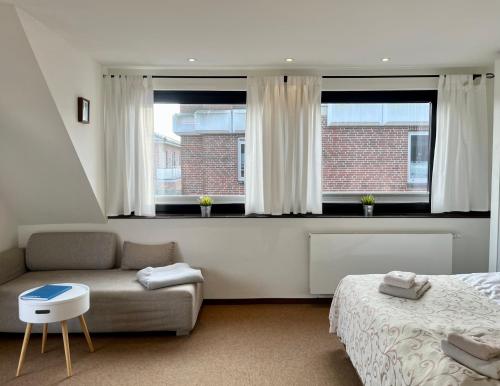 Ένα ή περισσότερα κρεβάτια σε δωμάτιο στο Appartementhaus Seemöwe Korallenmöwe