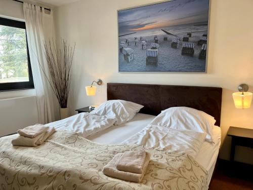 Ένα ή περισσότερα κρεβάτια σε δωμάτιο στο Appartementhaus Seemöwe Strandmöwe