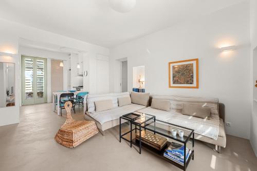 a living room with a couch and a table at Ondalina in Kardiani