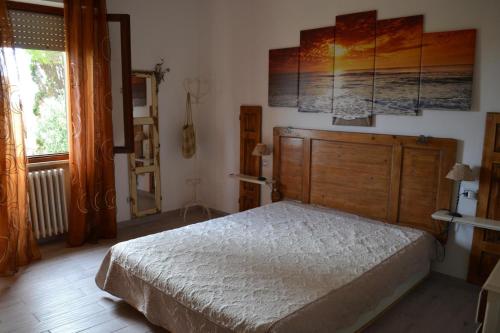 Ένα ή περισσότερα κρεβάτια σε δωμάτιο στο Casa di Tea costa etrusca piombino