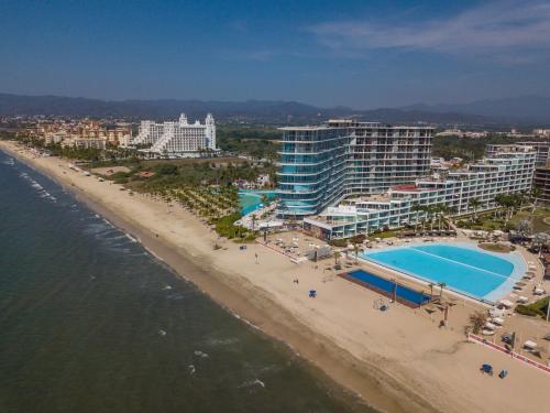 an aerial view of a beach and hotels at Aria Ocean Condominios in Nuevo Vallarta 