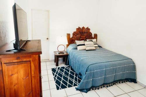 Ένα ή περισσότερα κρεβάτια σε δωμάτιο στο Boutique Hotel & Suites Hacienda Lord Twigg