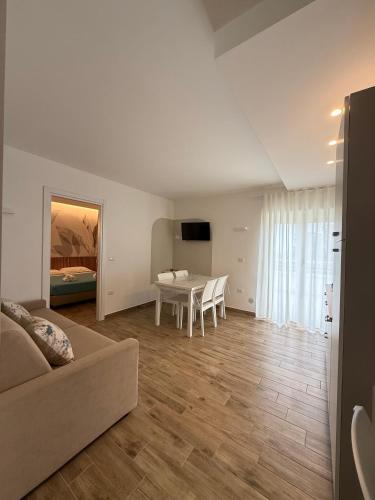 a living room with a couch and a table at SUNSEA - Enjoy Your Family in Capo Vaticano