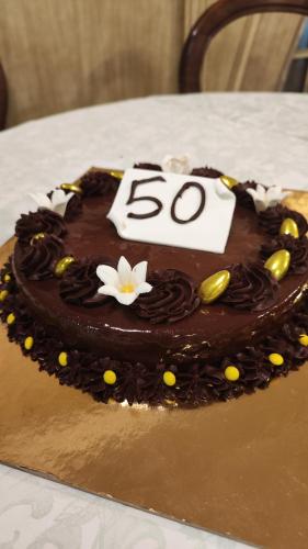 a chocolate cake with the on top of a table at Park Hotel in Vernante