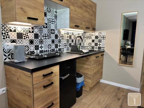 Kuchyňa alebo kuchynka v ubytovaní Apartamenty Przy Deptaku w Radomiu