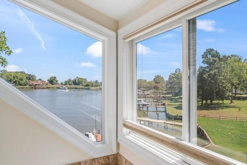 a window with a view of the water at Waterfront Getaway - Dock UR Boat & Walk to Beach in Annapolis