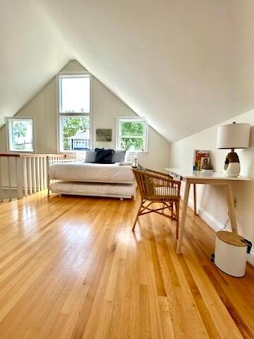 a bedroom with a bed and a desk in a attic at Waterfront Getaway - Dock UR Boat & Walk to Beach in Annapolis