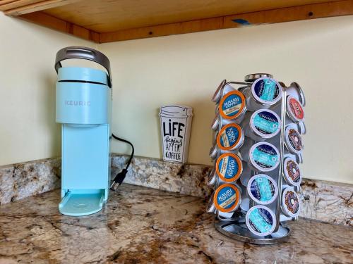 a water bottle and a container on a counter at Waterfront Getaway - Dock UR Boat & Walk to Beach in Annapolis