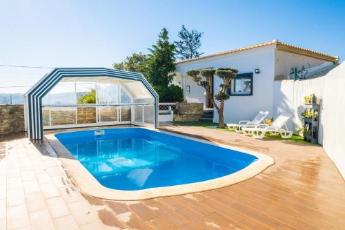 a swimming pool in the backyard of a house at Gaeiras Private Pool in Gaieiras